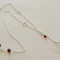 Sterling silver and genuine garnet briolettes necklace with hand wire wrapping detail.  $70